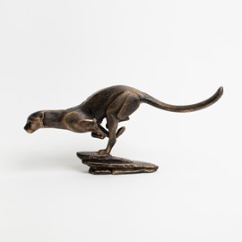 Cast-iron sculpture of a running cougar