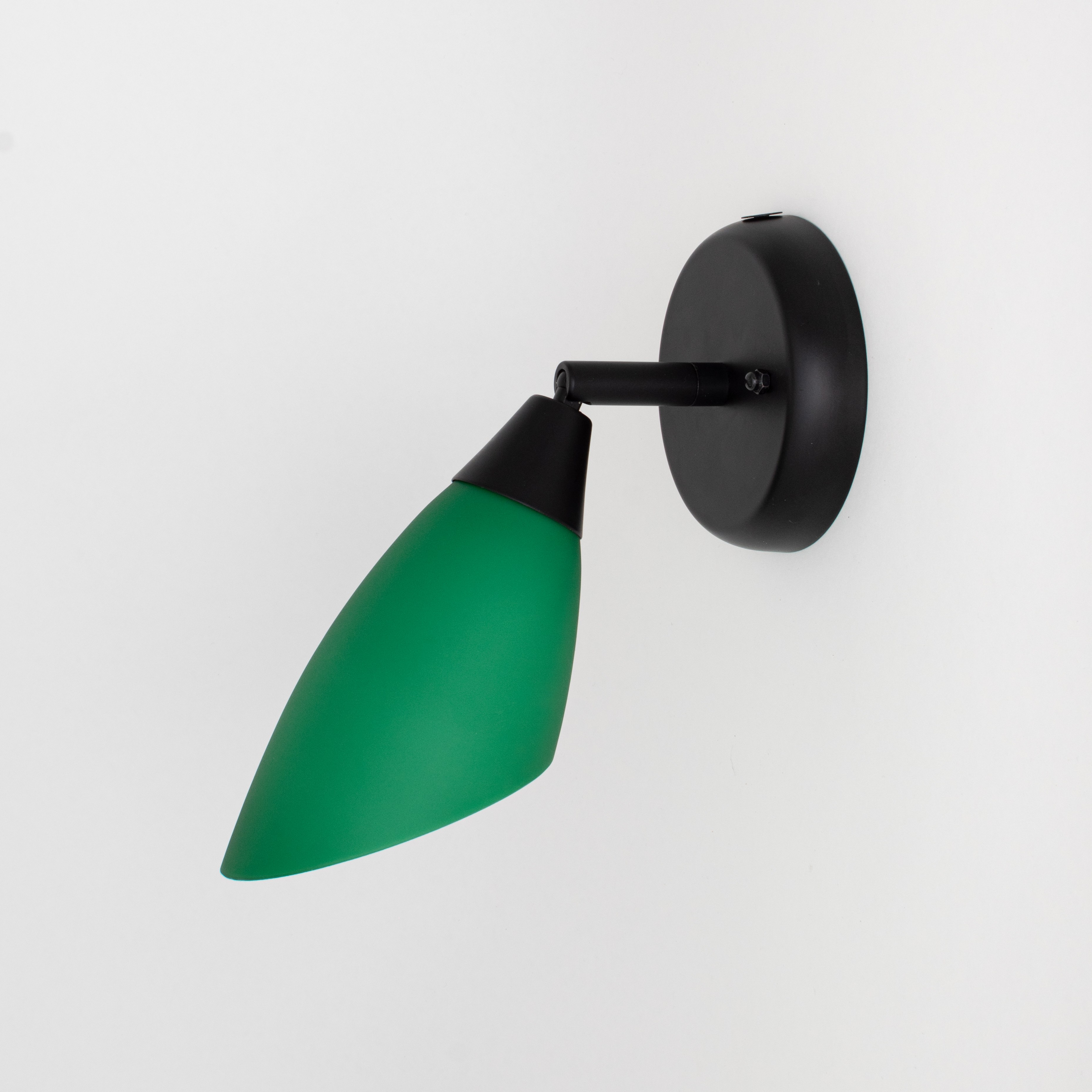Black wall spotlight with hinge and green glass shade
