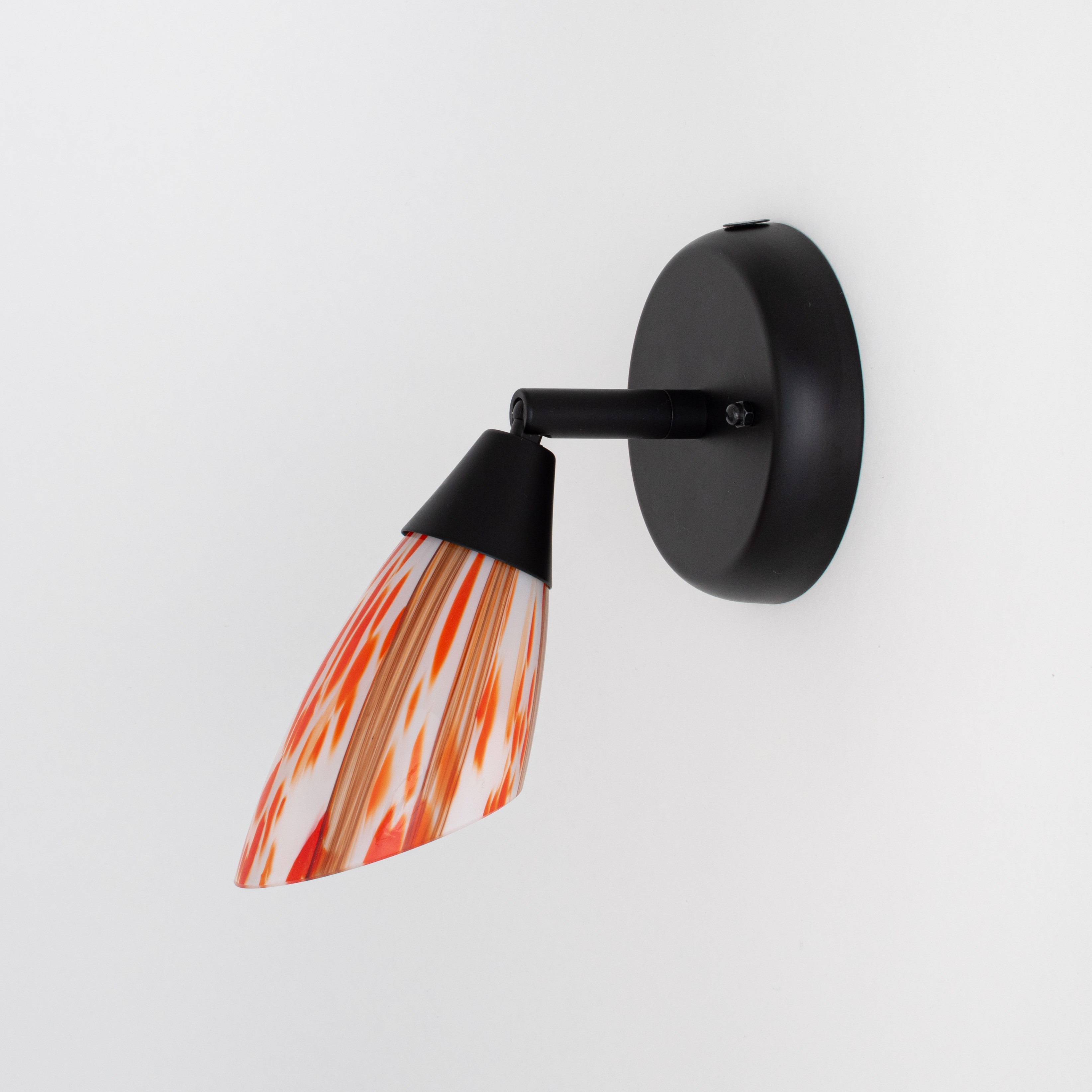 Black wall spotlight with hinge and red mottled glass shade
